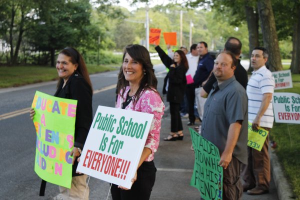 Terrie Killoran leads a group of protestors outside the Remsenburg-Speonk Elementary School. KYLE CAMPBELL