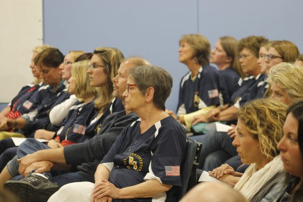 More than 30 teachers from the Remsenburg-Speonk Elementary School attended Monday night's School Board meeting wearing baseball jerseys bearing their name on the back and a Remsenburg-Speonk logo on the front. KYLE CAMPBELL