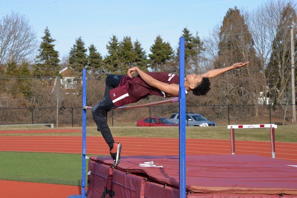 Armani Ray clears the bar in the high jump. MICHELLE MALONE