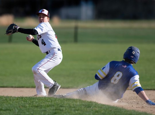 Pierson second baseman Christian Pantina gets the force out at second, but is unable to complete the double play. CRAIG MACNAUGHTON