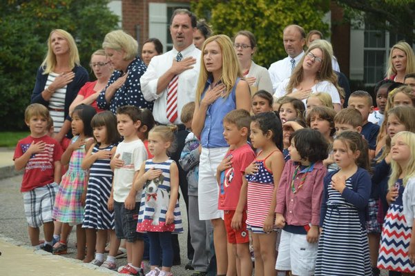 The Remsenburg-Speonk Elementary School community gathered by the flag pole on 9/11 to help break a Guinness World Record. AMANDA BERNOCCO