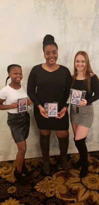 Southampton girls basketball players Maddie Taylor, left, Allysha Thomas and Taylor Pike with their postseason awards this past winter.
