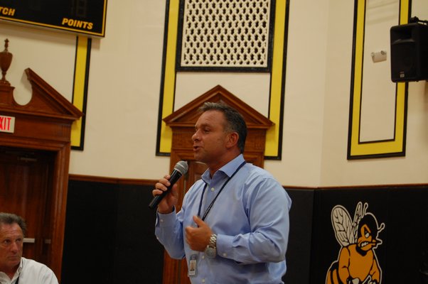 Bob Caliendo, a member of the team in charge of the Bridgehampton School expansion speaking at a public forum. JON WINKLER