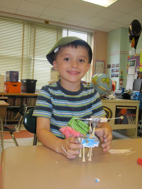 A student at the Riley Avenue Elementary School Camp Invention program invents his own machine.