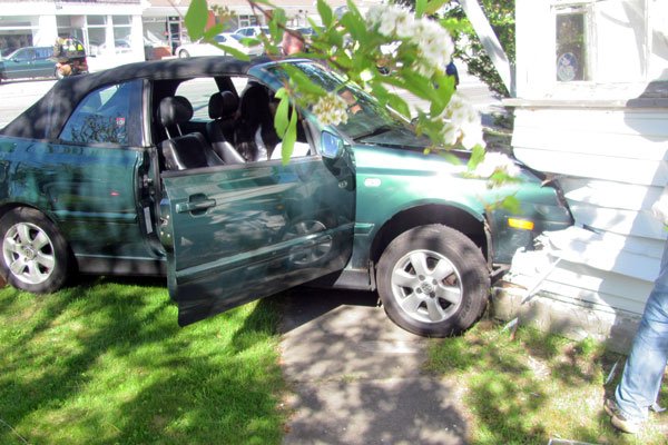 A 2001 Volkswagen convertible struck the front porch of a house on Mill Road in Westhampton Beach Friday afternoon. COURTESY WESTHAMPTON BEACH POLICE DEPARTMENT