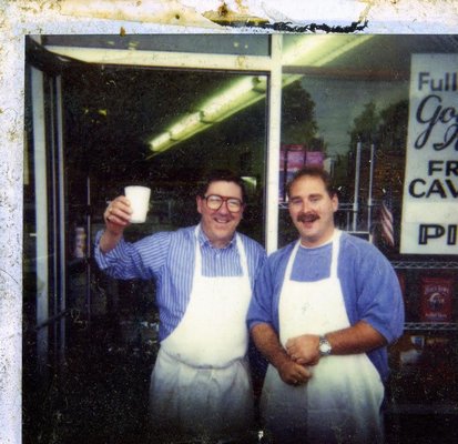 Eddie Dean at Dean's Market with his son, Bryan. COURTESY DEAN FAMILY