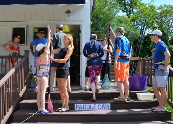Paddle Diva, which operates out of Shagwong Marina in Springs, is suing over a town ruling that it is violating zoning by using the marina as its base of operations. Kyril Bromley