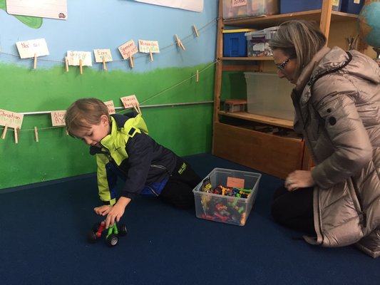Erik Vuik, 4, with his mother, Karolina Vuik, at the Love of Learning Children's Center in Quogue. CAILIN RILEY