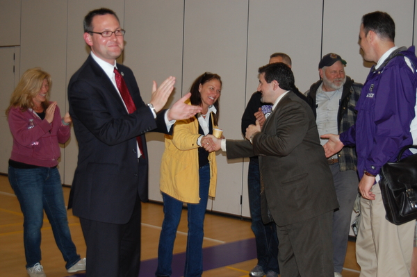 East Quogue School Board members Ralph Naglieri, left, and Joseph Tsaveras react to news that the school budget passed. LAURA COOPER