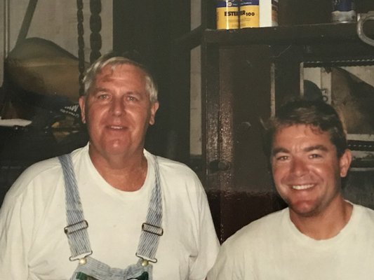 Cliff Foster and his son, Dean Foster, who took over operation of Foster Farm in 2001.