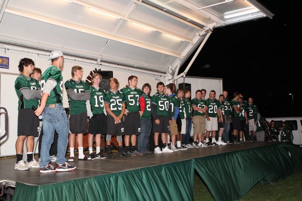 The Westhampton Beach varsity football team gets the crowd excited at its Homecoming bonfire on Thursday, October 9. Neil Salvaggio