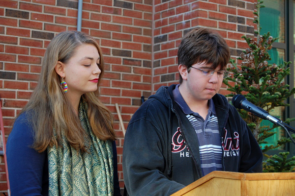 Students Josh Holzman and Lane Davenport address their peers in Westhampton Beach High School's courtyard.