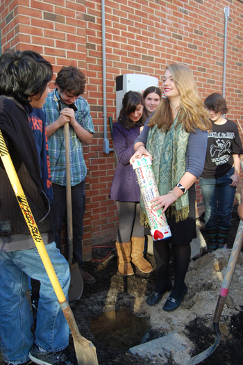 Lane Davenport prepares to bury a time capsule in Westhampton Beach High School's courtyard.