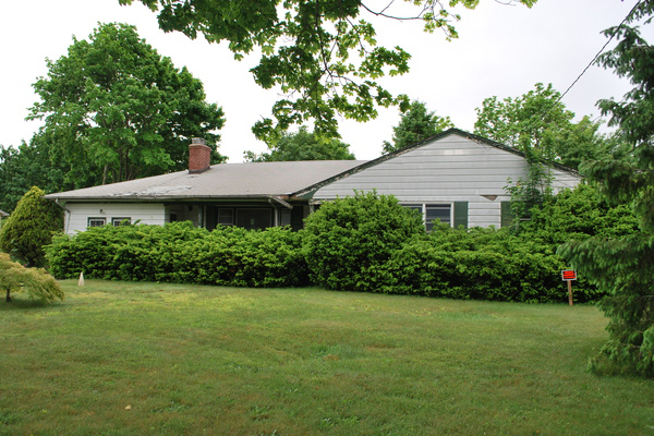 The East Quogue School District intends to demolish the house next door to the elementary school this summer.     WILL JAMES