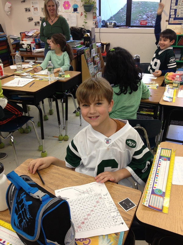 Third grader Alex DeLeva wear green for Sandy Hook Elementary students. ERIN MCKINLEY