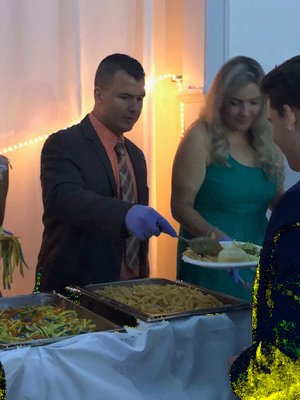 Principal Michael Miller serves students at prom. COURTEST MICHAEL MILLER