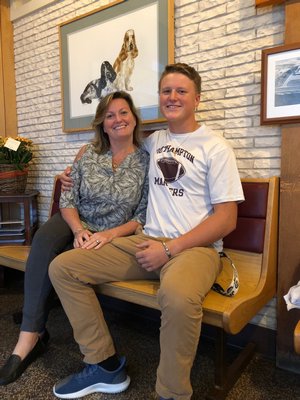 Southampton senior Shawn Stelling with his mom, Dawn Stelling, at the Olde Town Animal Hospital, where she is a veterinarian.