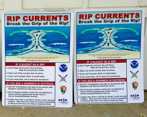 Jimmy Minardy posts rip current signs at East Hampton beaches.
