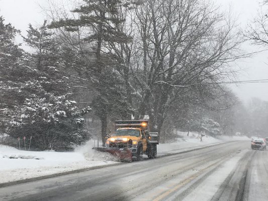 Plows clear Montauk Highway in Hampton Bays during Saturday's snow storm.   DANA SHAW