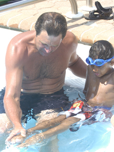 Kurt Billing gives a swim lesson to a Fresh Air Fund kid last summer.