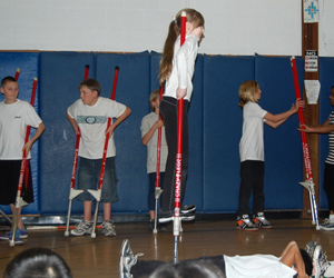 Sierra Sage performs her stilt walking routine at East Quogue Elementary School on Friday.     VERA CHINESE