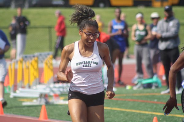 Oceane Ode in the 100-meter dash for Westhampton Beach at the state qualifier at Comsewogue High School on Friday.