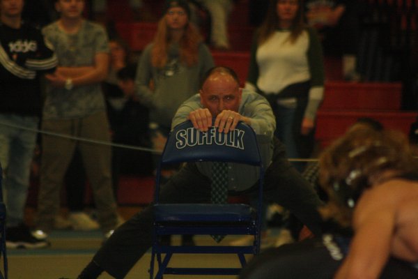 Westhampton Beach head coach Paul Bass tries to corral his emotions while watching sophomore Jackson Hulse in the final moments of his 4-3 win in the 160-pound championship bout. CAILIN RILEY