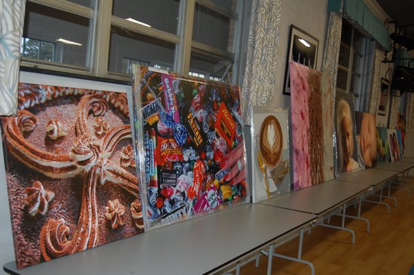 A line of paintings by Charles Wildbank on display at Our Lady of the Hamptons Regional Catholic School. JON WINKLER