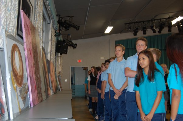 Students of Our Lady of the Hampton Regional Catholic School looking at paintings of artist Charles Wildbank. JON WINKLER