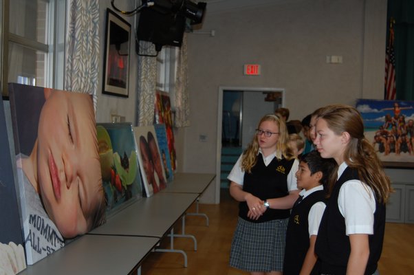 Students of Our Lady of the Hampton Regional Catholic School looking at paintings of artist Charles Wildbank. JON WINKLER