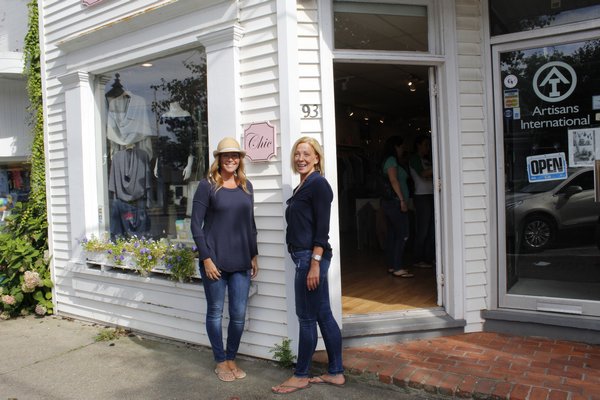Jaime Sussillo, owner of Chic, and Liz Lambrecht, owner of Impulse for Men, stand in front of their Main Street businesses. KATE RIGA