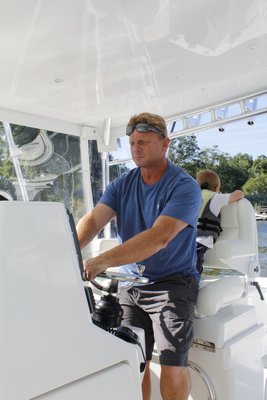 Gregg Desantis, Center Moriches boater and resident, takes his 40-foot boat out for a ride in Moriches Bay. KATE RIGA