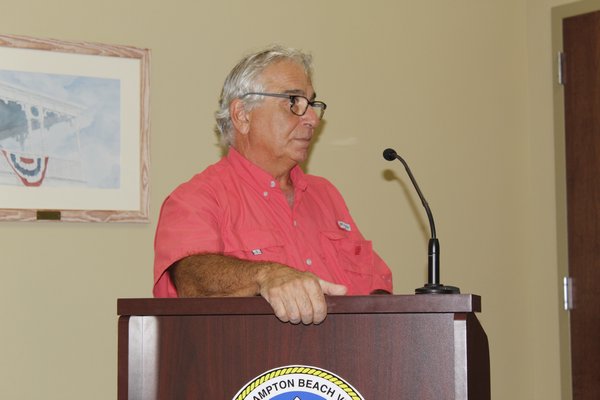 Local business owner David O. Assalti asks a question at the Village Trustee's June 3 meeting. KATE RIGA