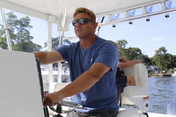 Gregg Desantis, Center Moriches boater and resident, takes his 40-foot boat out for a ride in Moriches Bay. KATE RIGA