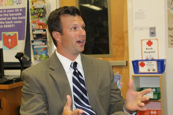 Westhampton Beach high school principal Christopher Herr makes a point in favor of eliminating class rank. KATE RIGA