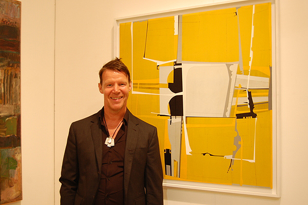 James Kennedy poses in front of one of his pieces.  DAWN WATSON