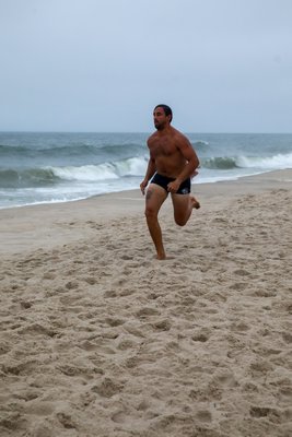 Ethan Mitchell in the run-swim-run.