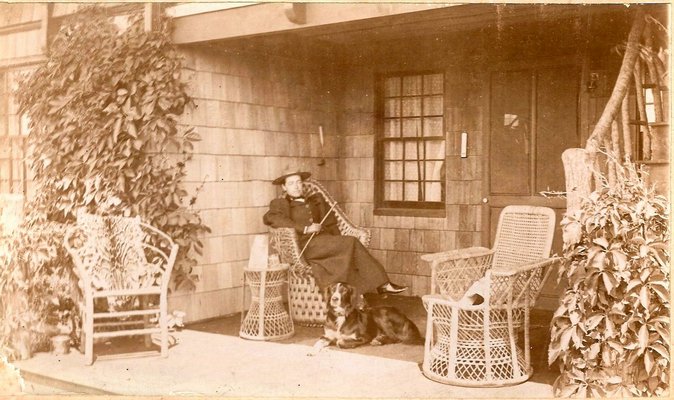 Zella de Milhau with her dog on the porch of Laffalot. COURTESY SOUTHAMPTON HISTORICAL MUSEUM