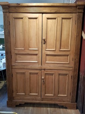 Late medieval style Wardrobe Cabinet with coffered doors at Ruby Beets Sag Harbor. JACK CRIMMINS