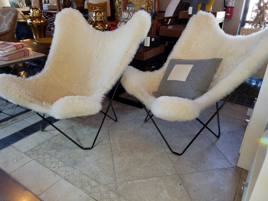 Iconic Knoll Butterfly Chairs with sheepskin give these classics an updated chic look and saves you from having them reupholstered. JACK CRIMMINS