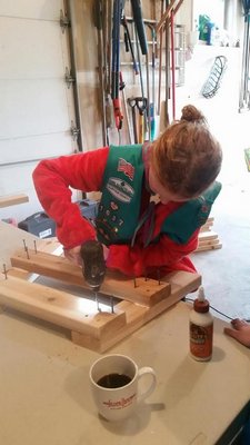 Sullivan Norton works on building a bench for her Bronze Award project. COURTESY ABBIE DERMODY