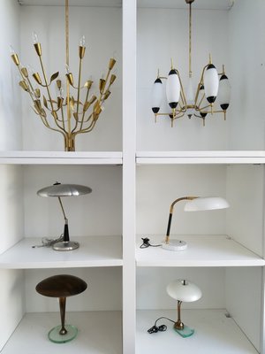 The ionic lghting dsigns of Mid-Century Modern by Italian powerhouses Stilnovo, Torlasco, Stylux, Arredoluce. These are the names collectors look for.  JACK CRIMMINS