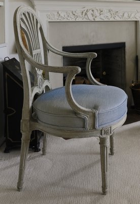 Her taste in chairs tended to be from the more restrained yet elegant period of Louis XVI, painted in well-weathered French gray-white, pointing toward an unfussy lightness. COURTESY SOTHEBY'S