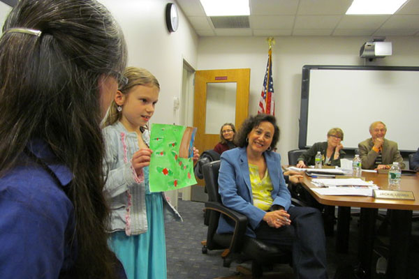 John Marshall Second-grader Anika Petruccelli shared her artwork and poem about spring with the East Hampton Board of Education on Tuesday night, April 16. Bridget LeRoy