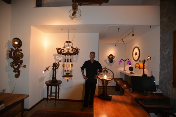Art Donovan in his Southampton studio with his Steampunk inspired hand-crafted lighting. ALEX GOETZFRIED