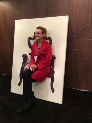An attendee tries out a two-dimensional chair. MARSHALL WATSON