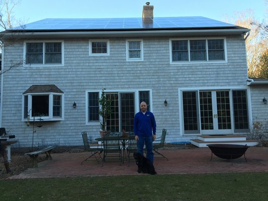 Bob Pucci outside his family's solar home in East Hampton. NICK PUCCI