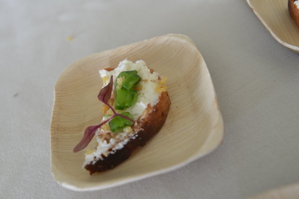 Homemade ricotta crostini with peas, preserved lemon and crispy millet by chef Alex Guarnaschelli from Butter and the Darby, NYC. ALEX GOETZFRIED