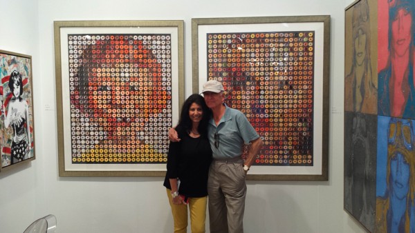 Candice CMC with concert promoter Ron Delsener in front of her iconic donut portraits