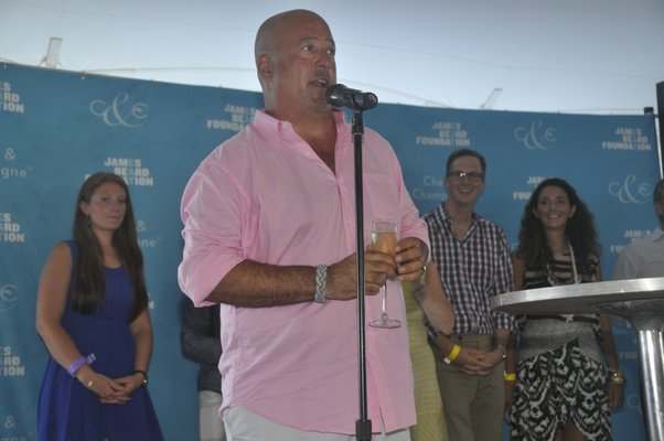 Andrew Zimmern makes a toast. MICHELLE TRAURING